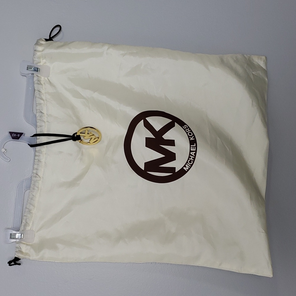 Michael Kors drawstring dust bag. 19” x 19”. And Gold purse emblem